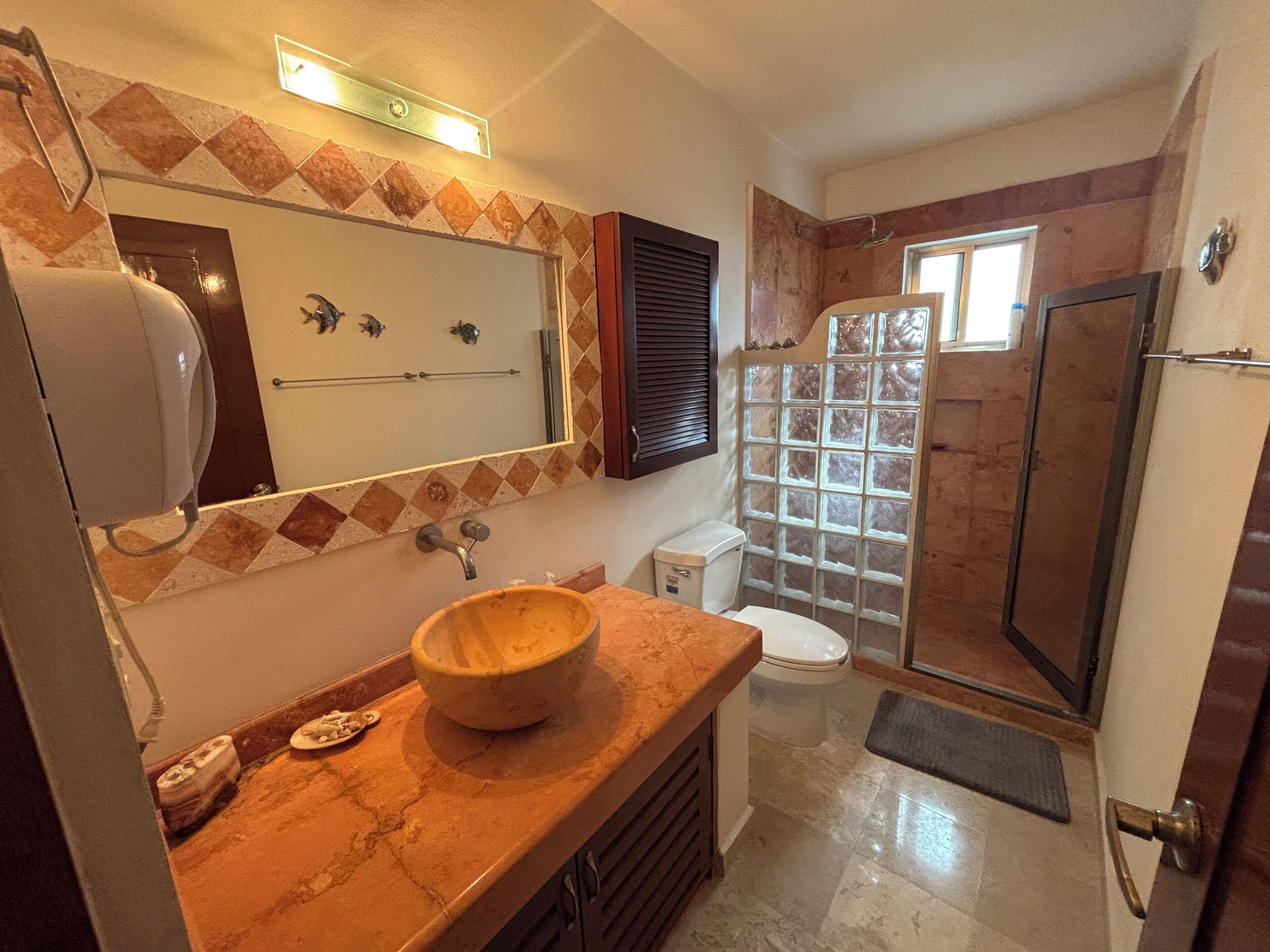 Shower, hair dryer, towels, toilet paper