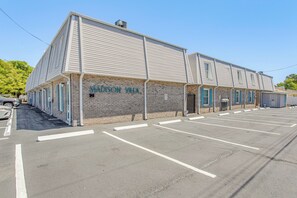 A two-story building with 'MADISON VILLA' signage, a parking lot, and a brick facade. - Walk to Ocean! Family Haven in North Myrtle Beach (North Myrtle Beach)