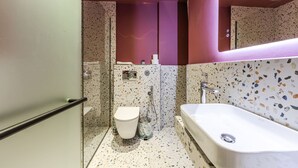 A modern bathroom with a freestanding bathtub, a shower, and a toilet. - Rose Studio 112 Love in Colours Collection (Durrës)