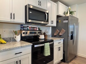 Fridge, microwave, oven, stovetop - Southern Tide | Tuscaloosa Retreat Near Bryant-Denny Stadium | Sleeps 8 (Northport)