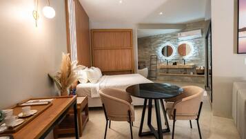 Luxury Suite, Garden View | Desk, laptop workspace, free WiFi