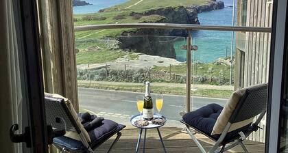 Ocean Front top floor apartment, with far-reaching views. Sleeps 4.