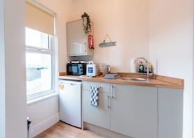 Fridge, microwave, cookware/dishes/utensils