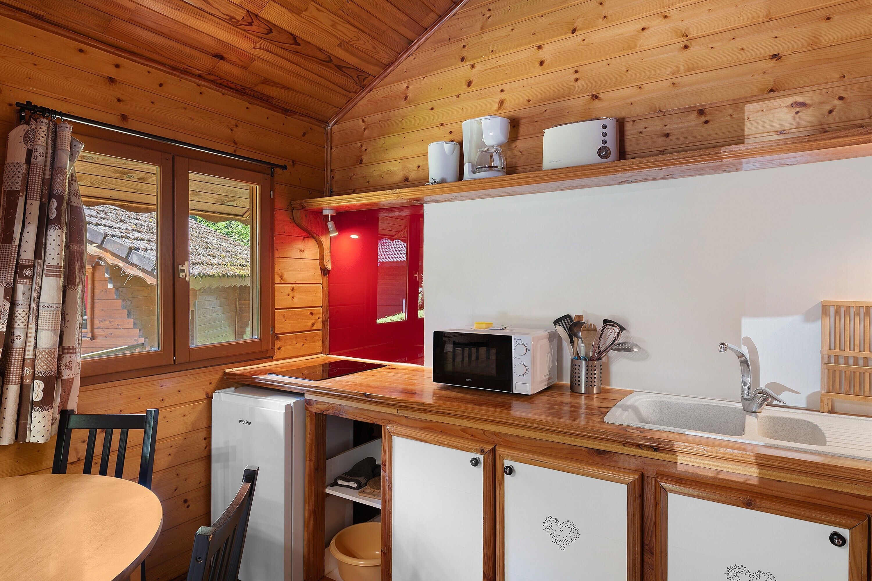 Fridge, microwave, stovetop, coffee/tea maker