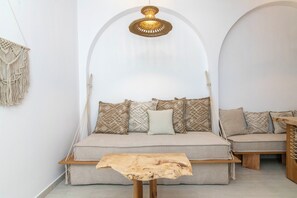 Grand Apartment, Sea View | Living area | Flat-screen TV