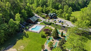 A large property with a swimming pool, a guesthouse, and a well-maintained lawn. - Pet-Friendly | Hot Tub | Outdoor TV | Game Room | Views | Sleeps 8 (Sevierville)