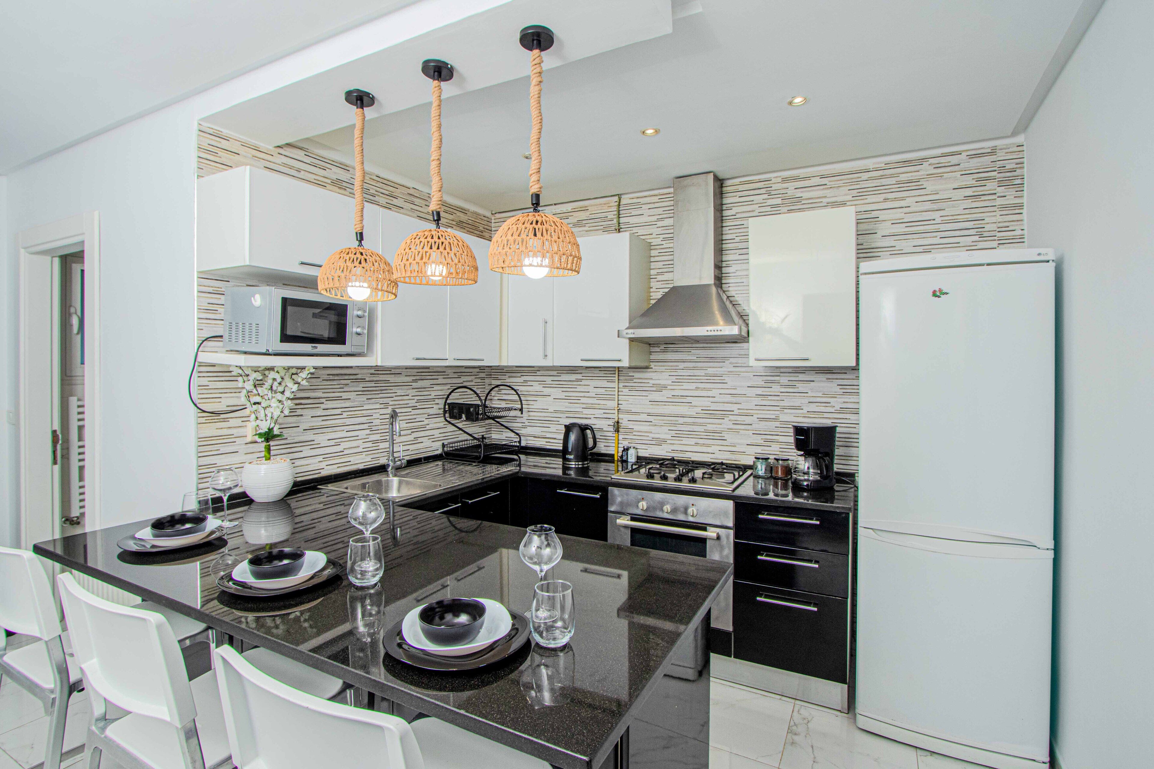 Deluxe Apartment, Balcony, Beach View | Private kitchen | Full-sized fridge, microwave, oven, stovetop