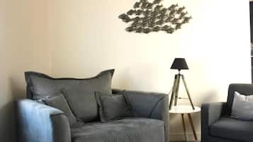 Comfort appartement | Woonruimte | Een 0-cm televisie met kabelzenders