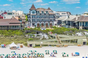 A beachfront hotel with a prominent tower, a boardwalk, and beach umbrellas. - ☀️Walk to Beach | 2 Pools | 30A | Beachside Villas 321- Family Tides☀️ (Santa Rosa Beach)