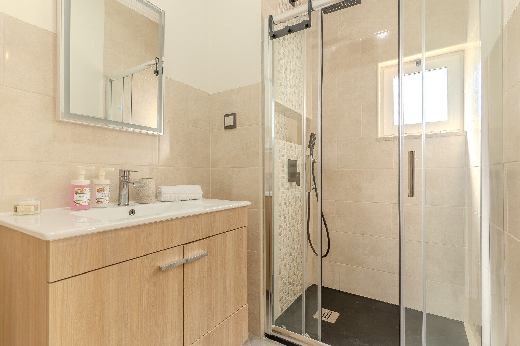 Shower, hair dryer, towels, soap