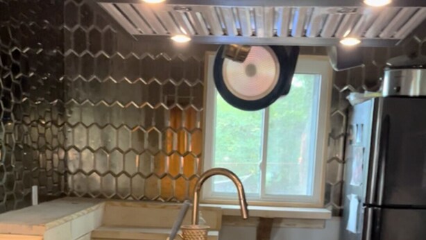 A kitchen with a stainless steel refrigerator, a dishwasher, and a stove. - 3-bedroom house in soothing Atlanta with cool AC comfort (Atlanta)