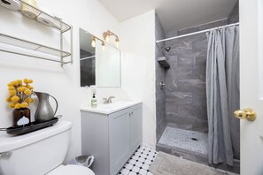 Shower, towels, soap, toilet paper