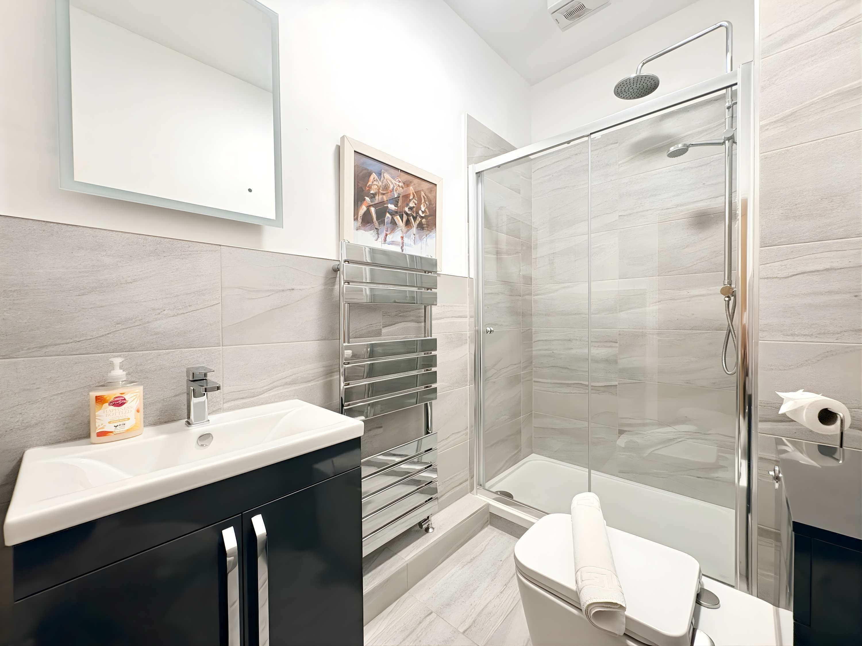 Shower, hair dryer, towels, shampoo