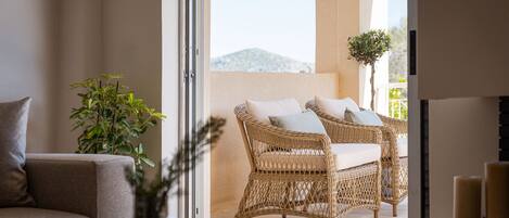 Deluxe Villa, Sea View | Living area | 65-inch Smart TV with satellite channels, fireplace, Netflix