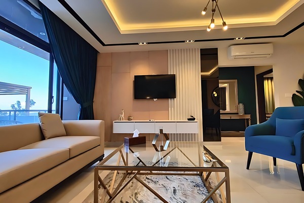 Deluxe Apartment, 3 Bedrooms | Living area | 32-inch flat-screen TV with cable channels