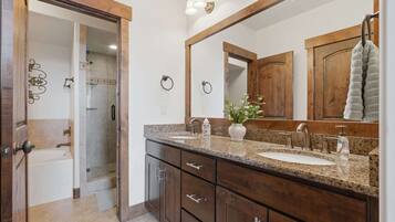 Shower, hair dryer, towels, shampoo