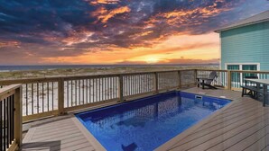 A swimming pool on a wooden deck with a view of the beach and sunset. - Private Pool | Gulf Views | Beachfront Access (Gulf Shores)