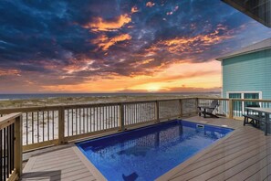 A swimming pool on a wooden deck with a view of the beach and sunset. - Private Pool | Gulf Views | Beachfront Access (Gulf Shores)