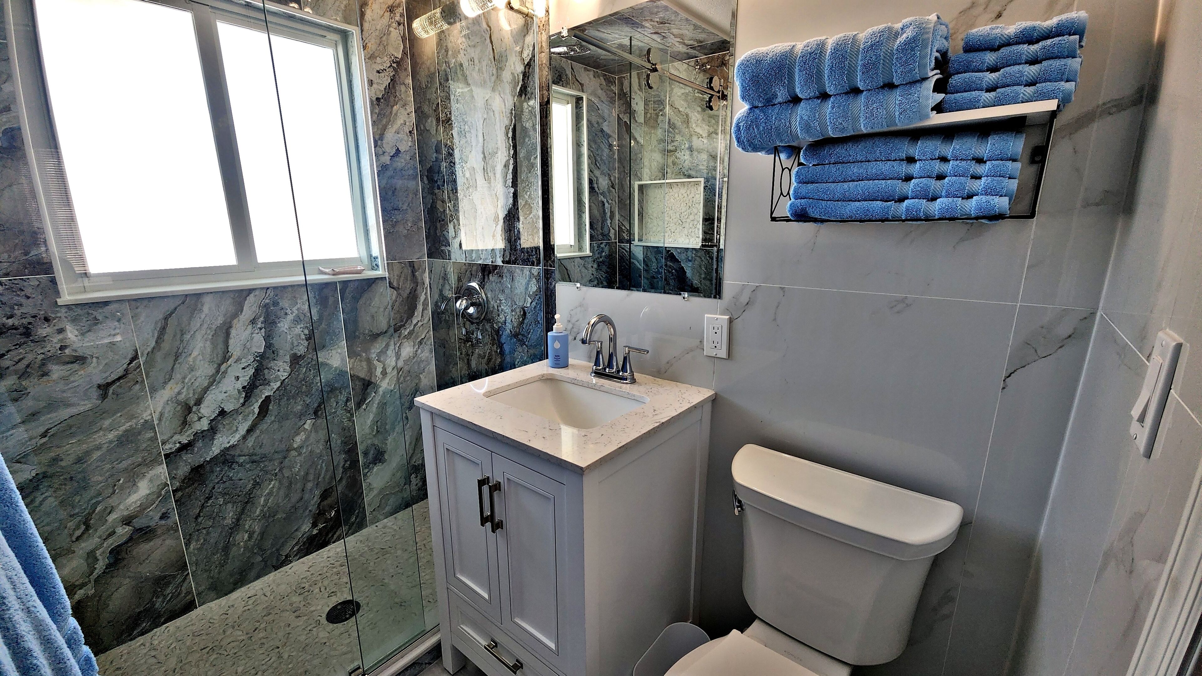 Shower, hair dryer, towels, soap
