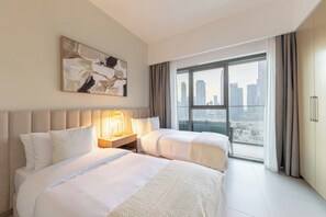 A hotel room with two beds, a city view, a large window, and a modern design. - Spacious 2BR with Burj Khalifa View (Dubai)
