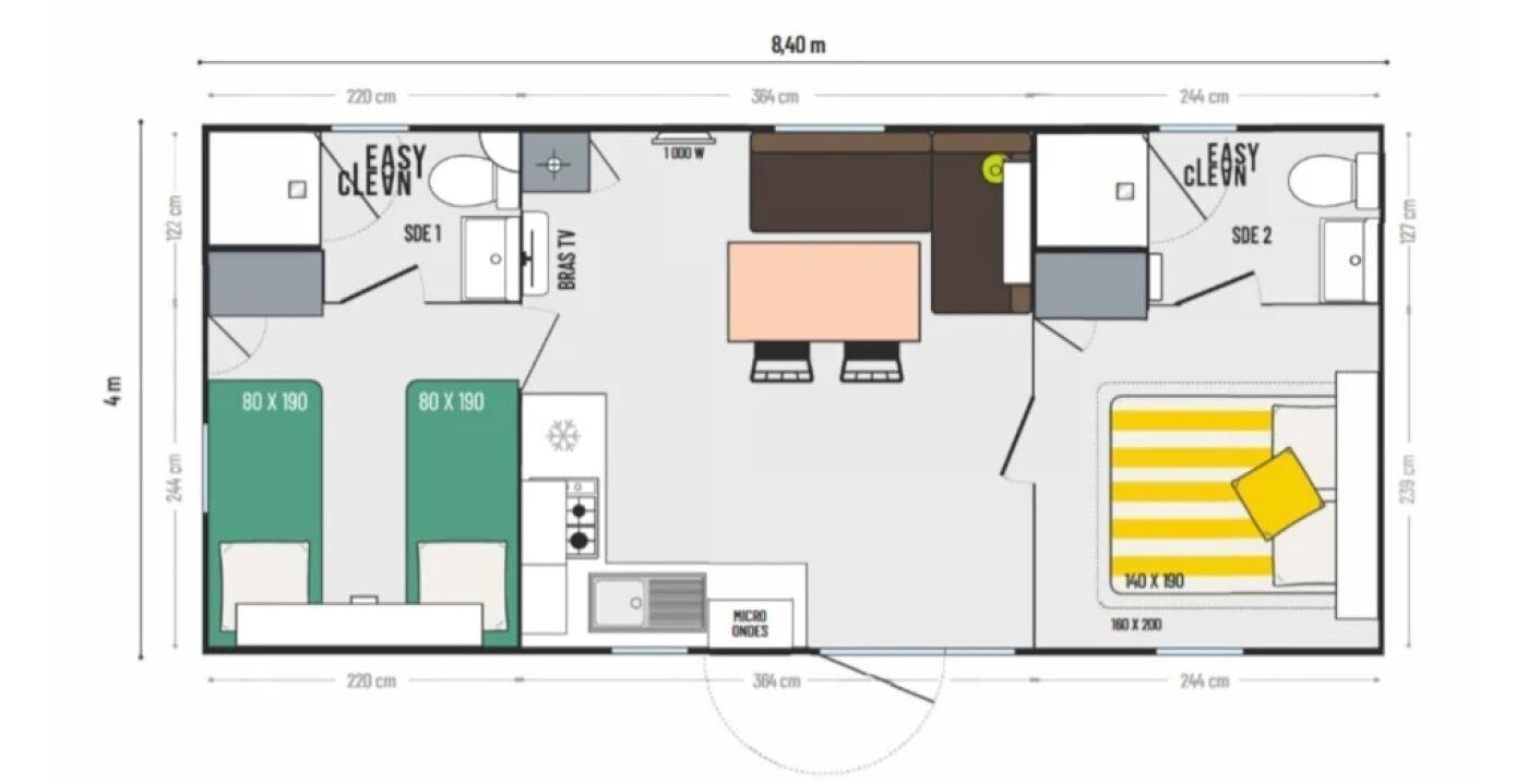 A floor plan of a hotel room with two beds, a kitchenette, a bathroom, and a dining area.