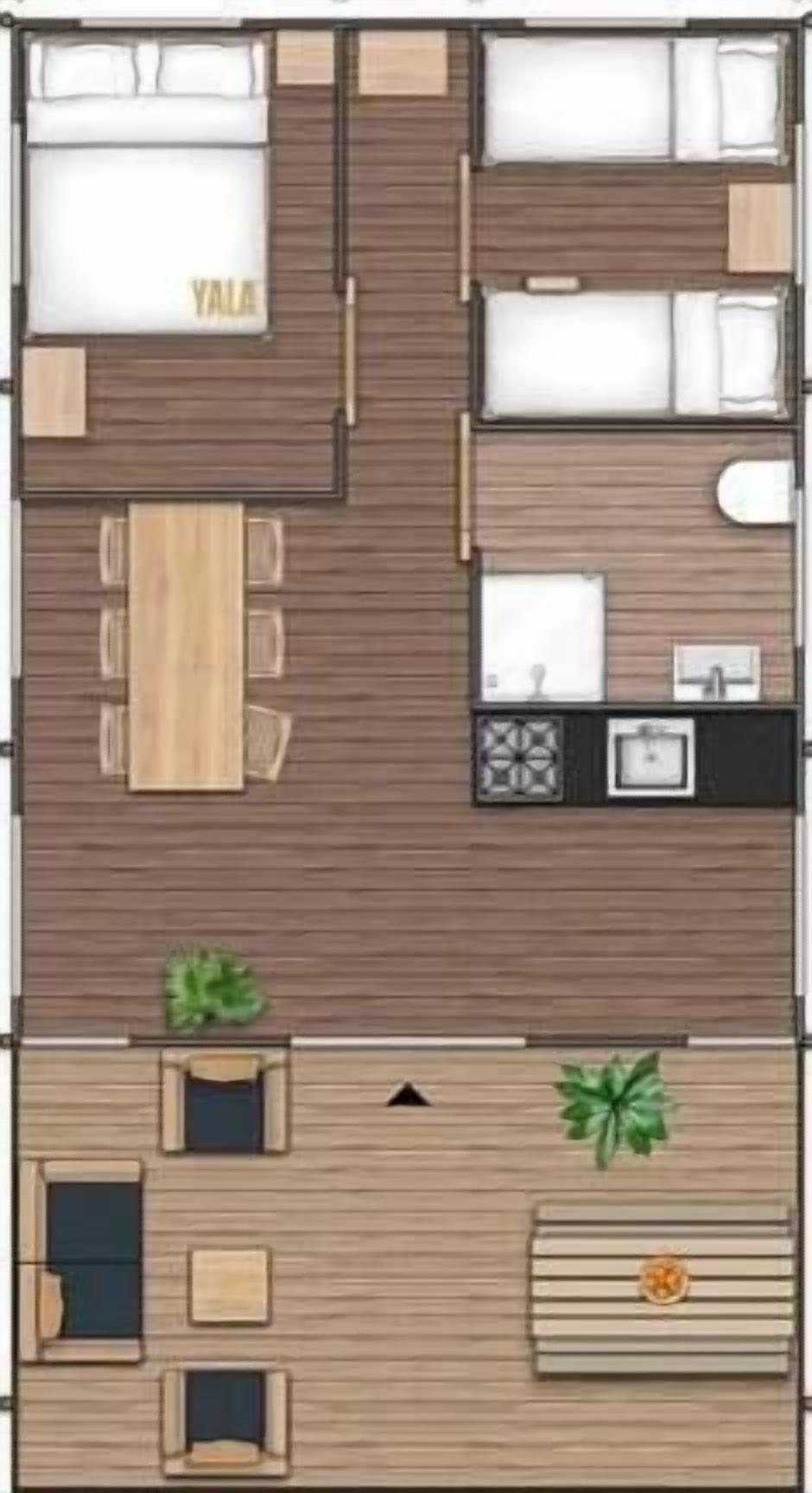 Un plan d’étage d’une chambre d’hôtel comprenant un lit, un bureau, une chaise, une petite salle de bain et un coin cuisine.