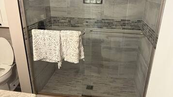 Shower, towels, soap, toilet paper