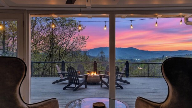 A deck with chairs and a fire pit, overlooking a scenic landscape. - Mtn Views, Game Room, Near Dollywood & Gatlinburg, Firepit, Hot Tub, Bunk Beds (Sevierville)