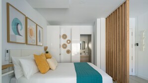 A modern bedroom with a bed, bedside table, wall art, and a wardrobe. - Sunset Loft By CanariasGetaway (Mogán)