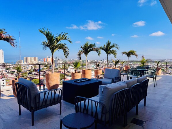 Outdoor dining - Designer 2BR w/ Rooftop Pool, Gym & Stunning Views (Puerto Vallarta)