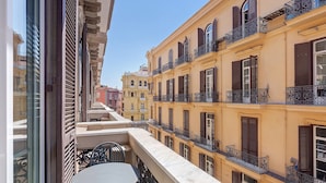 A multi-story building with balconies, a marble balustrade, and a view of adjacent buildings. - Apartment 'Deluxe Con Balcone' with Balcony, Wi-Fi and Air Conditioning (Napoli)