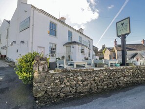 A white building with a sign reading 'Manor House' and a stone wall in front. - High Ickenthwaite Farmhouse (Ulverston)