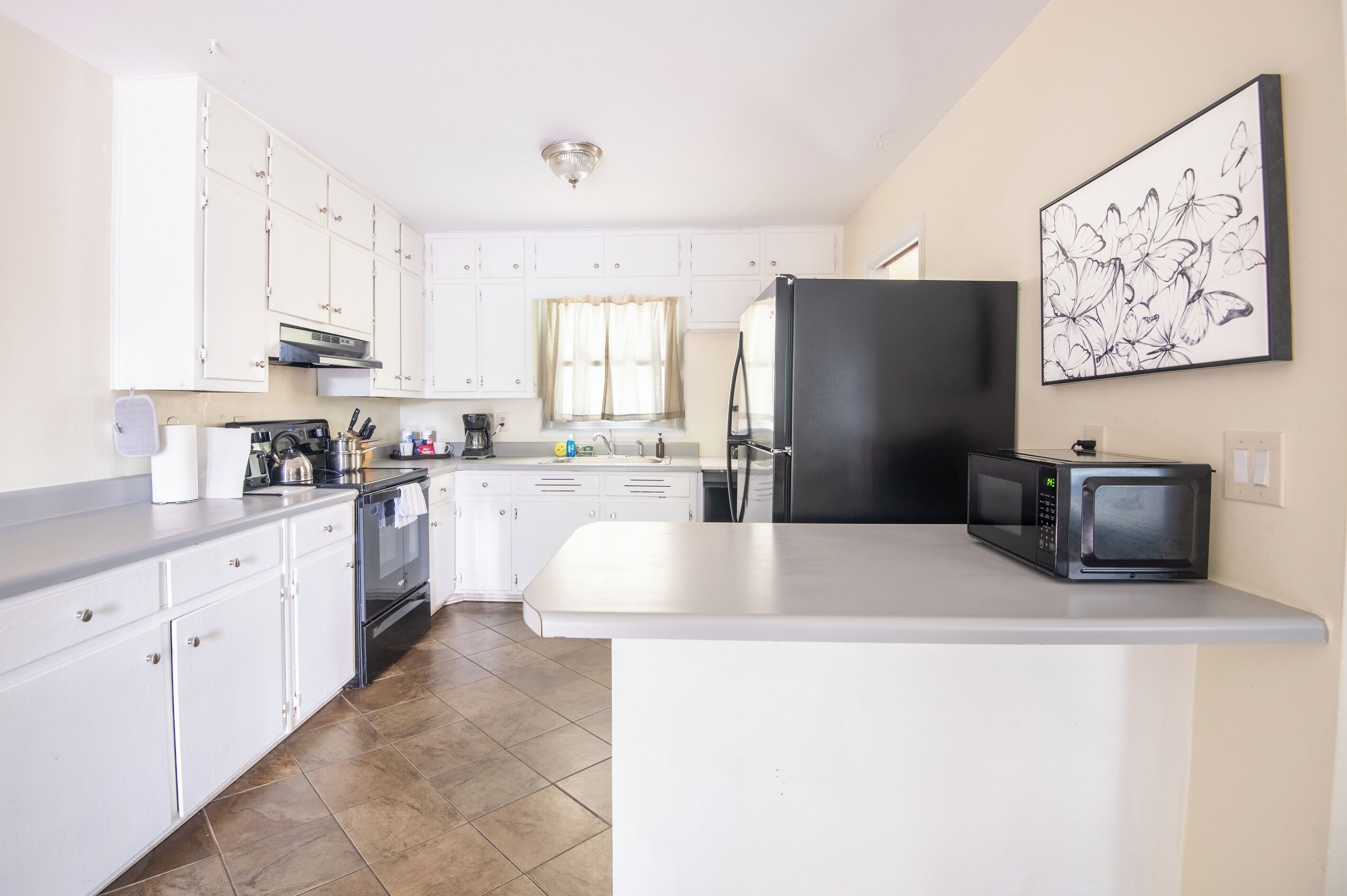 Coffee/tea maker, fridge, microwave, oven