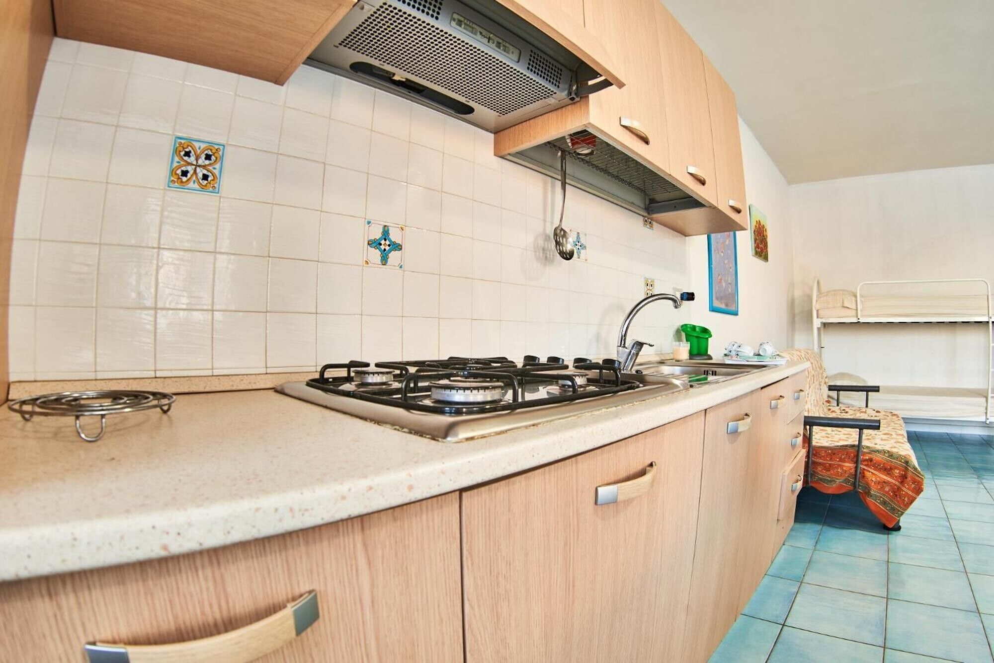 Fridge, stovetop, highchair, cookware/dishes/utensils