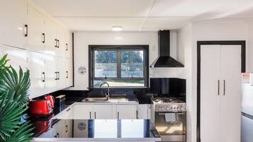 Fridge, microwave, toaster, cookware/dishes/utensils