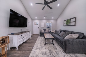 Living area - Welcome to The Coves Getaway — a peaceful, family-friendly 4-bedroom home. (Fayetteville)