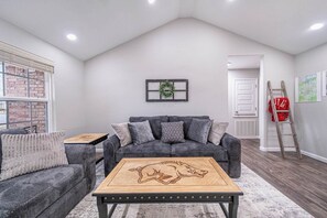 Living area - Welcome to The Coves Getaway — a peaceful, family-friendly 4-bedroom home. (Fayetteville)