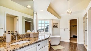 A bathroom with a granite countertop, sink, and bathtub. - Ridgemont Hall! Grand Mountain Home w/ Peak Views (Monument)