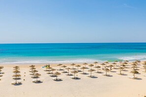 Private beach, beach umbrellas, beach bar