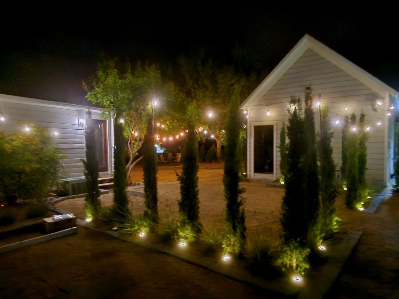 Glowing cypress-lined paths lead you home