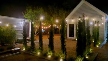 Glowing cypress-lined paths lead you home