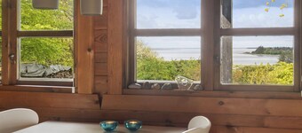 Nature holiday in peaceful log cabin by water