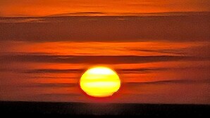 A sunset with a visible sun. - 2-bedroom house in peaceful Port Richey with cool AC (Port Richey)