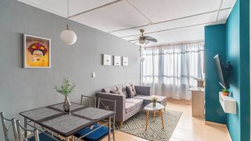 Apartment, 2 Bedrooms, City View | Living area | 42-inch flat-screen TV with satellite channels, books