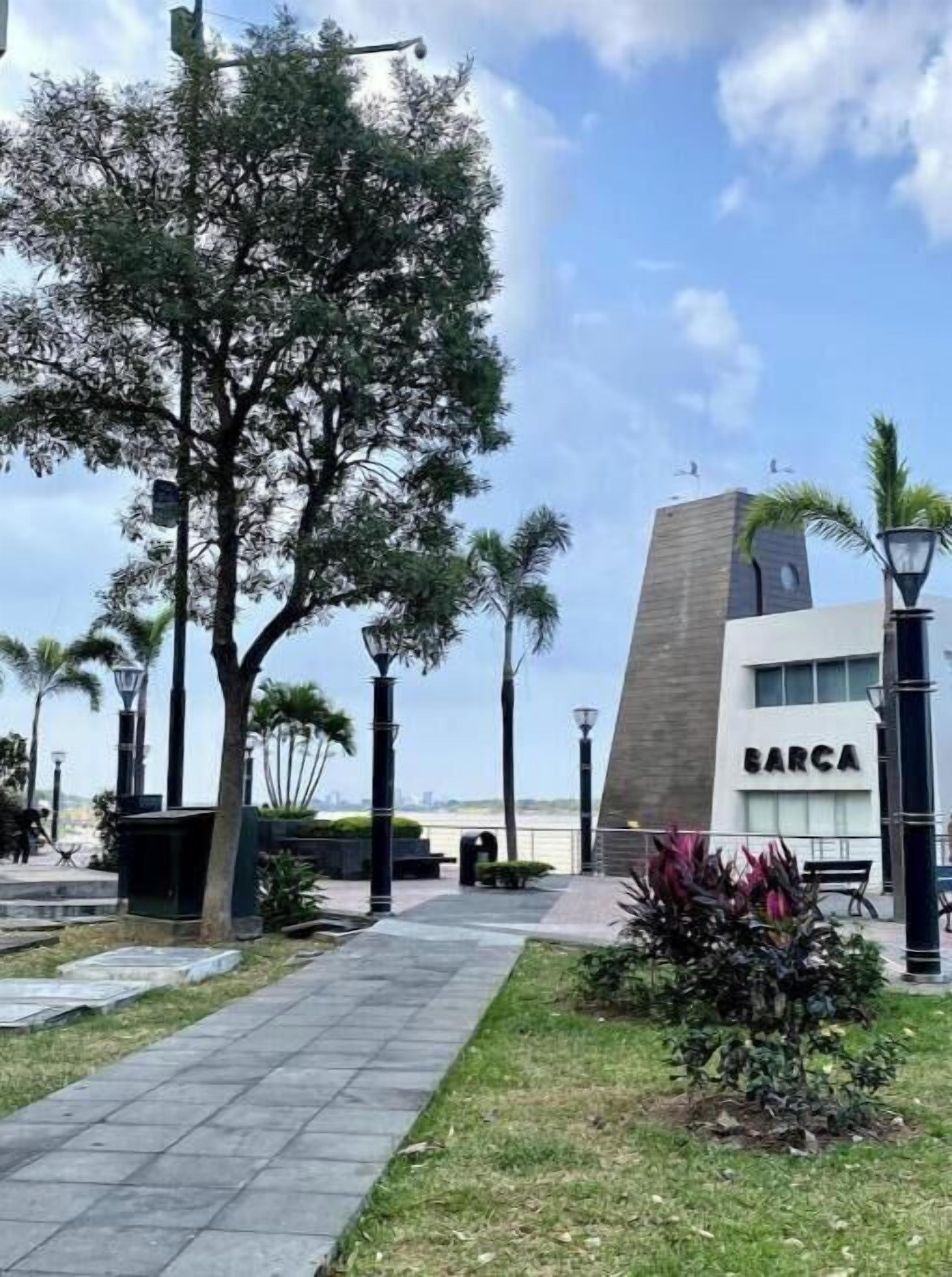 A modern building with a flat roof and a sign reading 'BARCA'.