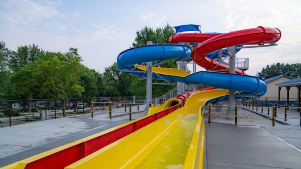 A water park with multiple slides in red, blue, and yellow. - Waterfront Cottage | Steps from Pine Lake & Resort Amenities | Resort Amenities (Pike County)