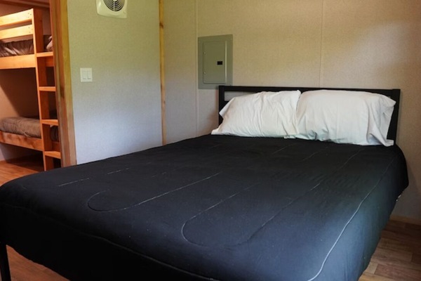 Unwind in a cozy bed after a day outdoors.