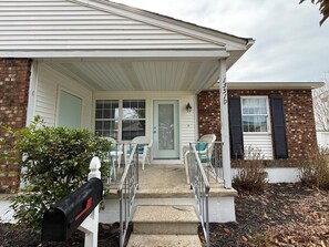 A house with a front porch, a mailbox, and a brick exterior. - Pet Friendly 2 Bedroom Home Close to Beaches and Restaurants (Cape May)
