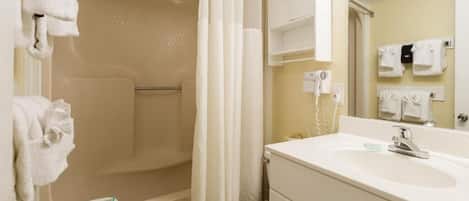 Hair dryer, towels, soap, toilet paper