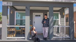 A residential building with a porch, a door, and a number sign '812 Arno Street SE'. - ZenDen Spa+Sauna+Hot Tub+Pet Friendly+No Pet Fee! (Albuquerque)